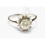 A diamond solitaire set in white metal, probably 18ct gold, with a fancy claw setting,