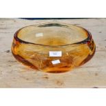 An amber glass bowl eleven inches by six inches approx