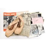 A pair of pink silk ballet pointe shoes with the name Toni Lander stamped to the base of one shoe,