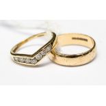 A 9ct gold band, size K, along with a white stone channel set wishbone ring, size I1/2,