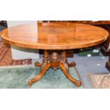 A Victorian walnut and marquetry inlaid loo table, the top with marquetry inlay,