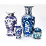 Four various blue and white oriental vases,