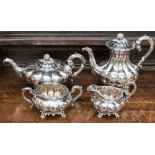 An Elizabeth II four piece silver tea and coffee service, melon-shaped comprising coffee pot,