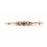 A sapphire and diamond yellow and white metal bar brooch,