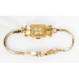 A vintage ladies Dreffa 14ct gold watch on a gold plated bracelet, gross weight approx 14.