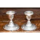 A pair of small silver candlesticks, Chester 1913,