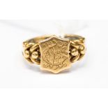 An 18ct gold signet ring monogrammed initial to shield front, approx 6.