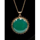 A 9ct gold surround jade type pendant,