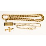 A 9ct gold ingot pendant and chain with a further rope chain and a 9ct crucifix,