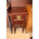 A Chinese red lacquered and hand carved single drawer table