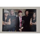 A modern photograph of AC/DC bearing signatures (unable to verify if these are authentic