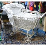 Large white whicker work pram with bedding