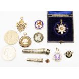 A Birmingham silver case containing a tie pin with red stone centre and gold head,