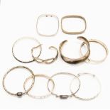 Ten various silver bangles, some set with mother of pearl and stone decoration, 6.46 ozt/200.