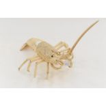 A carved ivory lobster