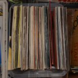 A box of records, to include: The Clash Combat Rock, Lou Reed Transformer,