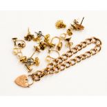 A 9ct gold small hollow link charm bracelet with padlock fastener, approx 3.