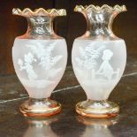 A pair of frosted pink frilled glass vases gilded rim with Mary Gregory style romantic couple