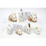 A group of seven Royal Crown Derby paperweights:Snowy Rabbit, Baby Rowsley Rabbit,