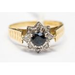 A sapphire and diamond 18ct yellow gold star design cluster ring,