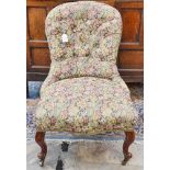 An early Victorian spoonback upholstered chair,