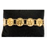 A Chinese yellow metal bracelet of ten circular links cast characters, approx 10 grams,