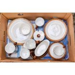 A Poole chestnut coloured part tea set, including cups, saucers, side plates, dessert plates,