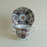A Worcester chocolate cup and saucer painted in Kakiemon colours in the Queens pattern, circa 1770,