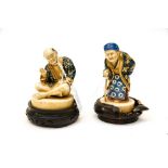 Two Japanese Satsuma figures on stands, male and female circa early 20th Century,