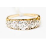 A diamond five stone boat head 18ct yellow gold ring, five round old cut diamonds,