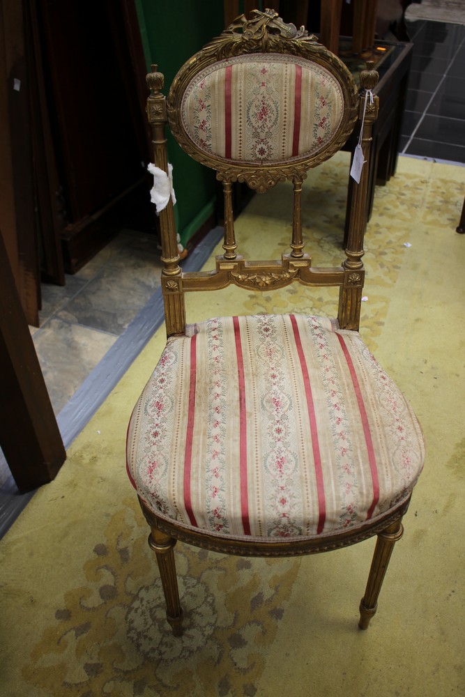 An early 19th Century French giltwood ladies parlour chair, the frame probably beechwood,