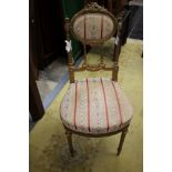 An early 19th Century French giltwood ladies parlour chair, the frame probably beechwood,
