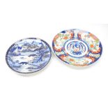 A late nineteenth Century Japanese imari charger and a blue and white example featuring Mount Fuji