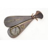 A Japanese set of scales in an oar/paddle shaped carrier,