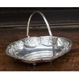 An oval silver swing handle basket, London 1915, maker probably Robert Pringle,