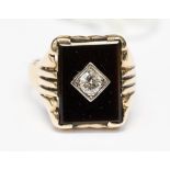 A diamond and black onyx rose gold ring marked 10K,