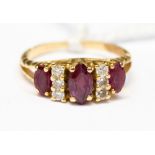 An 18ct gold ring set with rubies and diamonds,