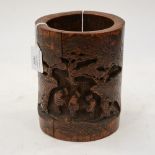 A 19th Century Chinese bamboo brush pot, carved with elders in a woodland meeting scene,
