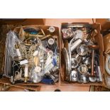 Two boxes of assorted metalware and flatware,