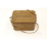 An early World War Two gas mask tin - no mask but with contents