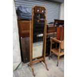 An early 20th Century walnut veneered cheval mirror