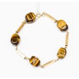 A tiger's eye 18ct gold bracelet,