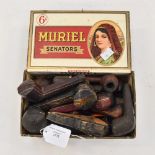 A collection of early 20th century pipes and cigarette holders, some in original boxes,