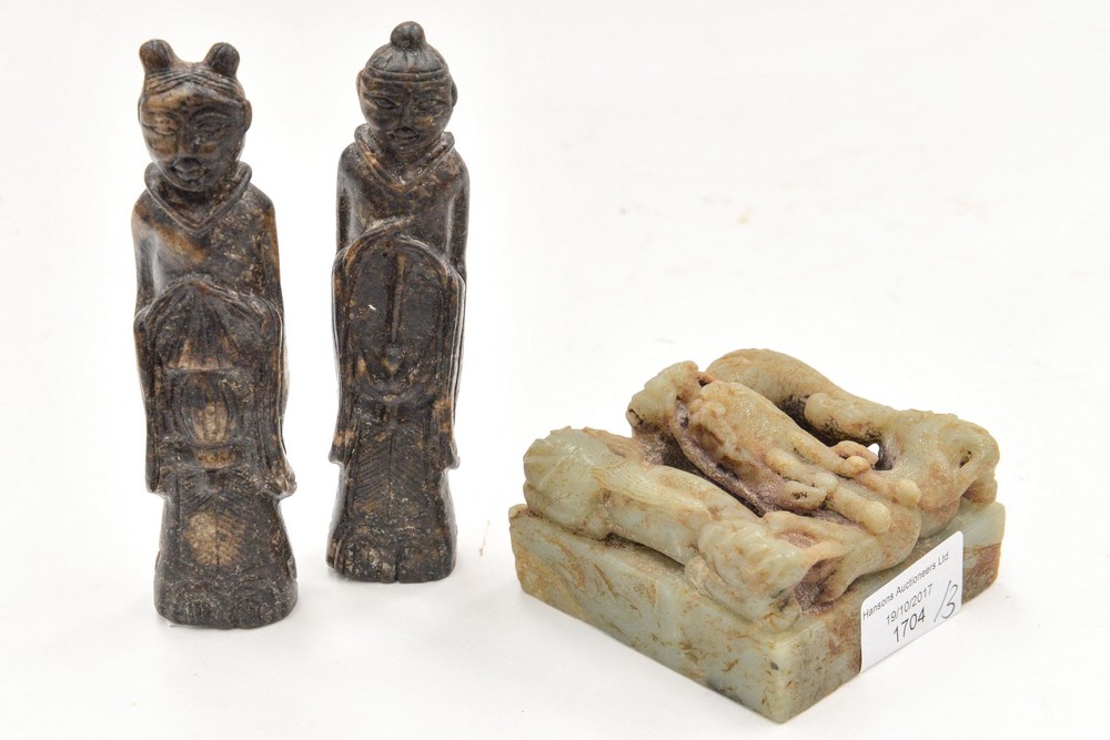 Two carved stone figures,