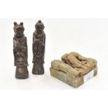 Two carved stone figures,