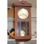 An early 20th Century mahogany eight day wall clock,