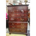 A George III mahogany chest on chest, the upper section with two short over three long drawers,