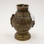 A Chinese bronze vase, Qing dynasty, main body cast in relief with diverse flower heads,