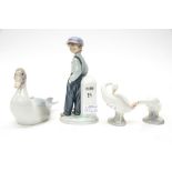 A Lladro figure of a boy,