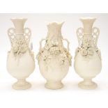 A pair of Parian twin handled vases,